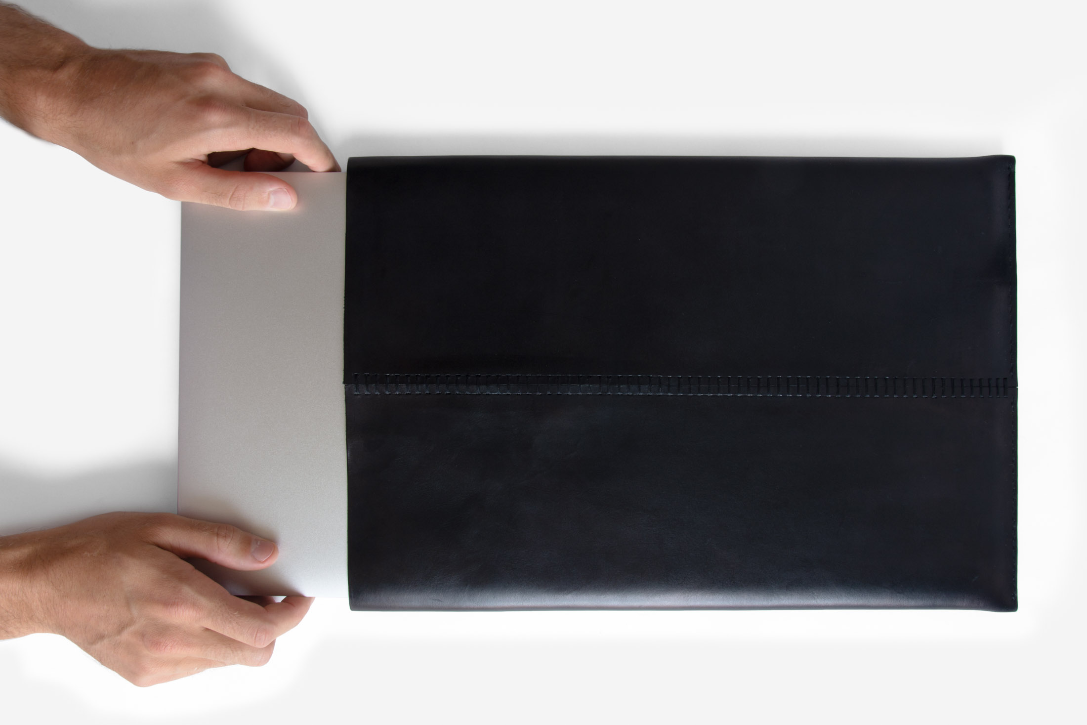 200729-Leather-Laptop-Case-Black-Top-View-With-Hands-rA